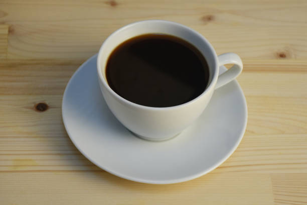 istock Cup of coffee on the wood table background 1500889442