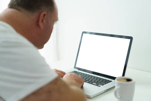 istock Man checking an email on laptop in morning. 1500891286