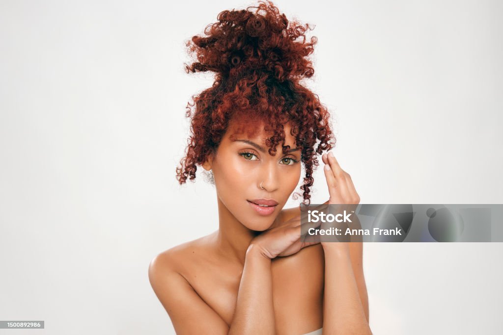 Beauty portrait of a stunning girl with afro hair Beauty portrait of mixed race girl with afro hair. Cosmetics, makeup, and fashion Freshness Stock Photo