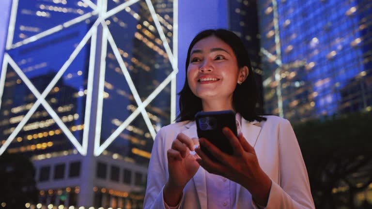 Investment success, Asian woman successfully investing in the stock market, expressing joy.