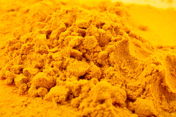 istock Turmeric powder closeup texture background 1500897161