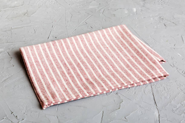 istock top view with red empty kitchen napkin isolated on table background. Folded cloth for mockup with copy space, Flat lay. Minimal style 1500897182