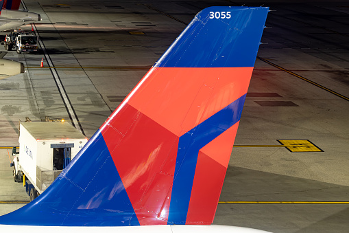 Logan International Airport, Boston Massachusetts, USA - October 2023.  Aircraft on the hard standing and the runway at the airport.