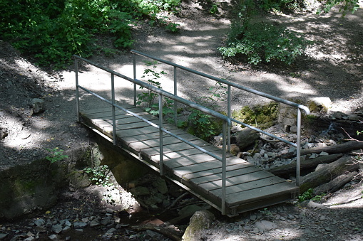 tiny river bridge on a hiking trail