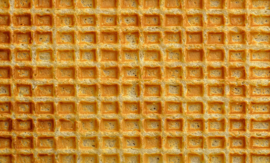 Three crispy fried french waffles isolated on white background