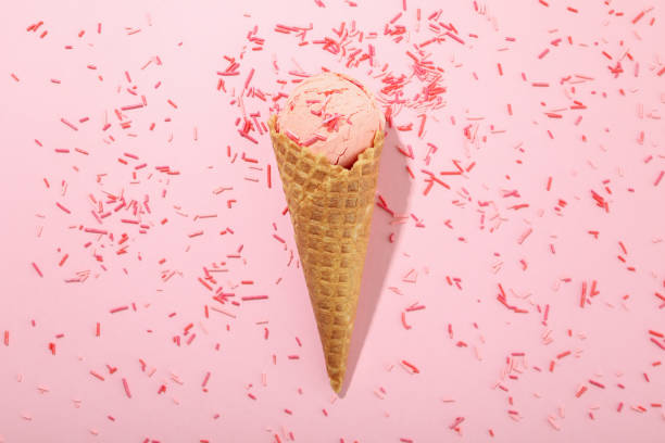 istock Ice cream and sprinkles on pink background 1500903241