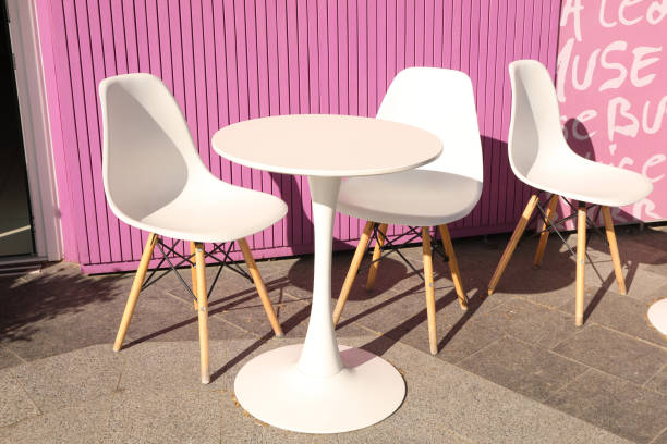 istock Chairs and table near stylish cafe outdoor 1500904146
