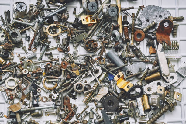 istock Iron sundries,mess.Various metal bolts, nuts, washers, fasteners scattered 1500907501