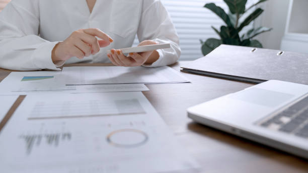 istock Business Professional Chartered Accountant Woman working with computer and calculator Sales Invoice Accounting 1500909194