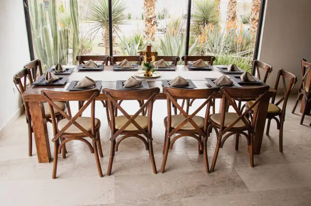 a large dining table is set with place settings for eight