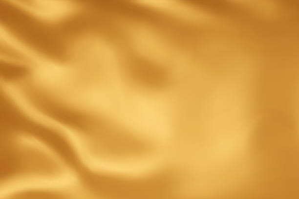 istock Close-up texture of natural gold silk. Light Golden fabric smooth texture surface background. Smooth elegant gold silk in Sepia toned. Texture, background, pattern, template. 3D vector illustration. 1500913788