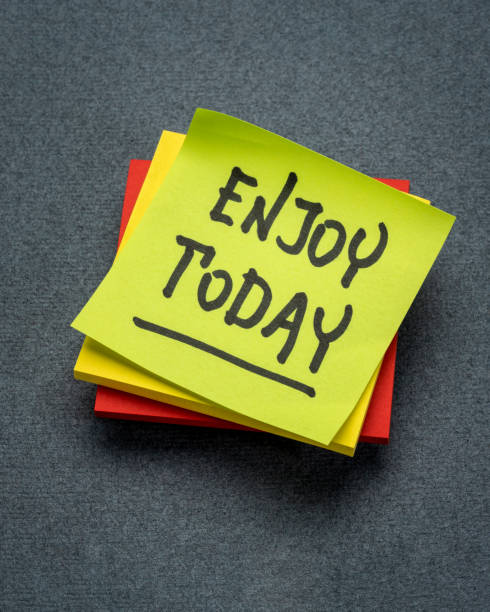 istock Enjoy today reminder - handwriting on a sticky note, positive attitude and mindset concept 1500916338