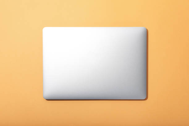 istock Blank laptop on beige background, top view 1500917574