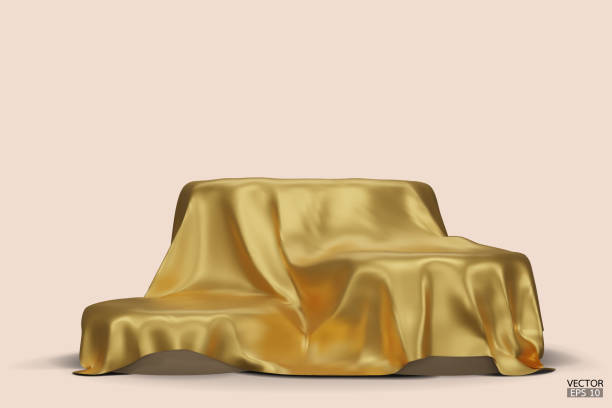 istock Podium covered with a piece of gold silk isolated on beige background. Realistic box covered with gold cloth. Podium for product, cosmetic presentation. Creative mock up. 3d vector illustration. 1500918920