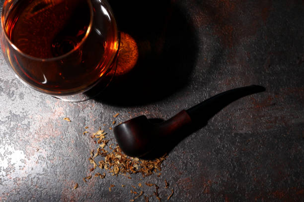 istock Composition of relaxation with smoking pipe and whiskey 1500927775