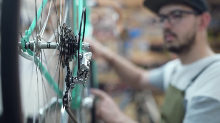 Bike shop owner working on a vintage bike.