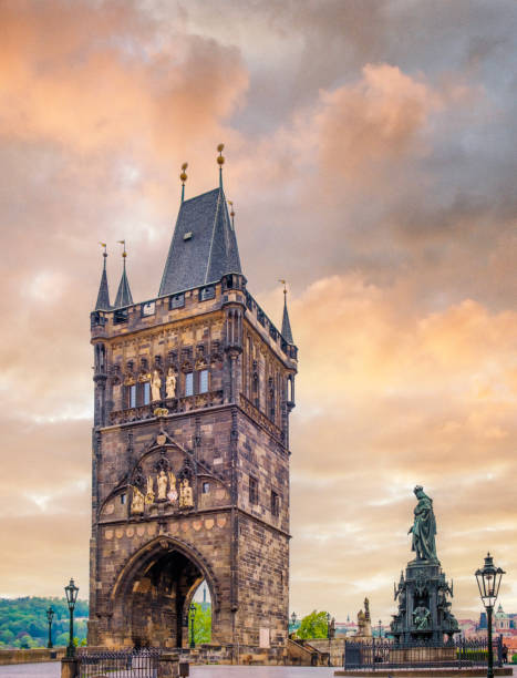 Old Town Bridge Tower, Prague The Old Town Bridge Tower is a Gothic tower, along with the Charles Bridge. And the Statue of Charles IV in Křižovnické Square. Both was built in the mid-14 th century. old town bridge tower stock pictures, royalty-free photos & images