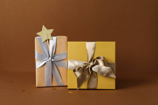 istock Concept of gift, gift boxes on brown background 1500937324