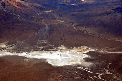 Arequipa province, Peru: salt lake (salar) - dry salt flat surrounded by mountains - rich in lithium brine - Lithium is used in rechargeable batteries. With increased use of smartphones, mobile computers, and electric cars, there is higher demand for the soft, silvery metal. Peruvian highlands.