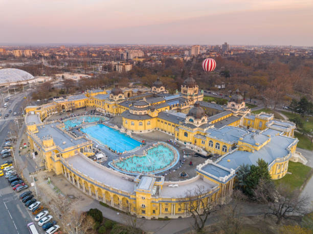 Thermal Bath Szechenyi in Budapest, Hungary. People in Water Pool. Drone Point of View. Budapest, Hungary - February 10, 2023: Thermal Bath Szechenyi in Budapest, Hungary. People in Water Pool. Drone Point of View. thermal pool stock pictures, royalty-free photos & images