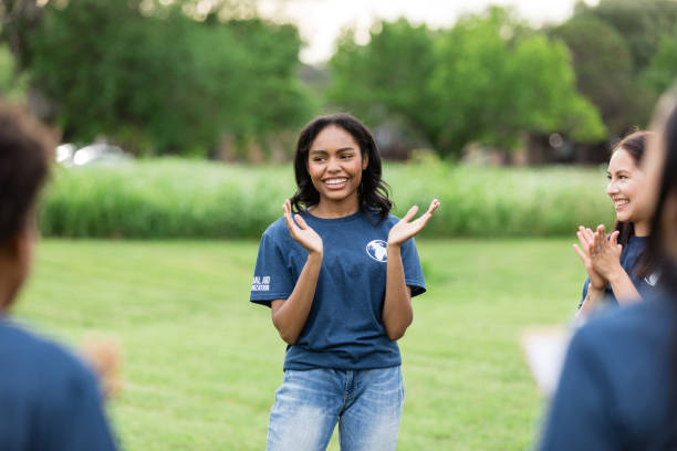 istock Diverse volunteers stand in circle and cheer before beginning work 1500955787
