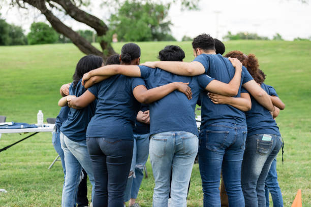 istock Large diverse group of unrecognizable volunteers huddle before beginning day 1500955803
