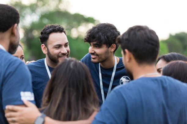 istock Diverse volunteers talk together in huddle 1500955808