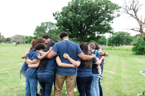 istock Diverse volunteers huddle together to pray before work 1500955817