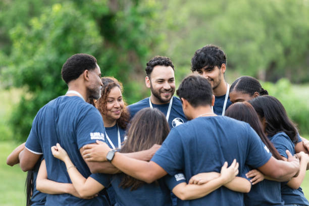 istock Standing in huddle, volunteers review their day 1500955830