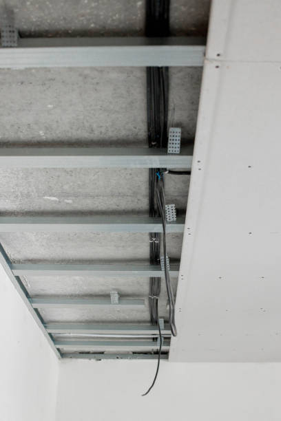 istock Structure with profiles and plasterboard for installation of suspended ceiling 1500961651