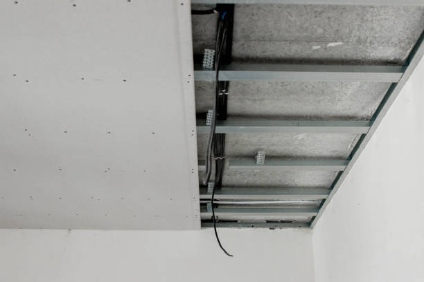 istock Structure with profiles and plasterboard for installation of suspended ceiling 1500961669
