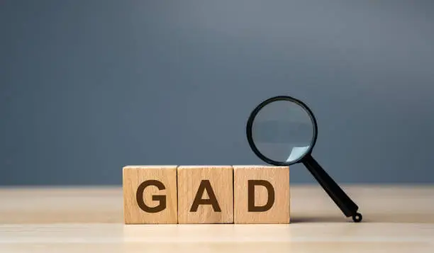 Wooden blocks GAD - Generalized Anxiety Disorder. Mental and behavioral and anxiety disorder characterized by excessive, uncontrollable and often irrational worry about events or activities