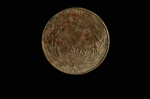 Colombian coins in closeup-antiguas