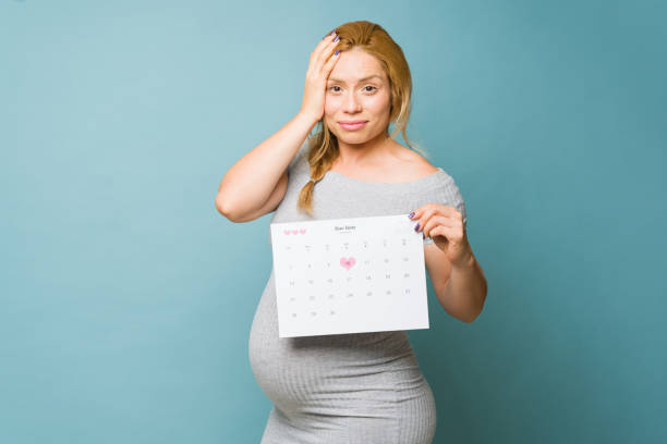 istock Pregnant woman stressed about her upcoming due date in a studio 1500968069