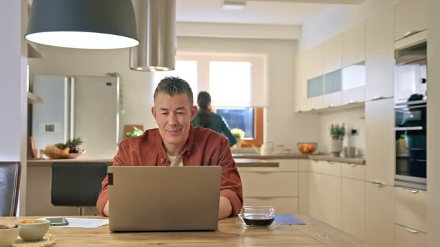 Man working on his laptop at home