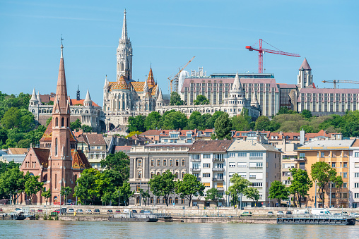 Watertown and Castle Hill neighborhoods in Budapest, Hungary. View from across Danube, with the Fishermans Bastion, Matthias Church and Szilagyi Dezso Church.