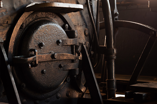 Photograph of steam train boiler lid, inside the cabin.