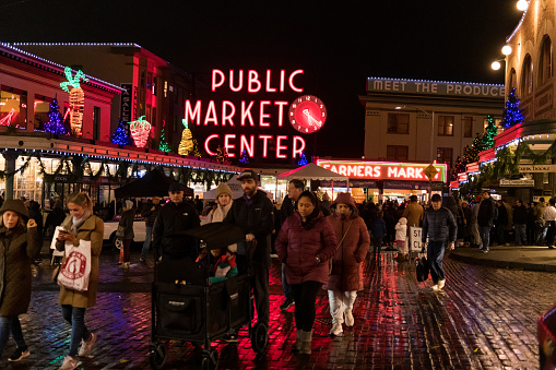 Seattle, USA – Nov 26, 2022: The annual Christmas tree lighting celebration at Pike Place Market early in the night in downtown.