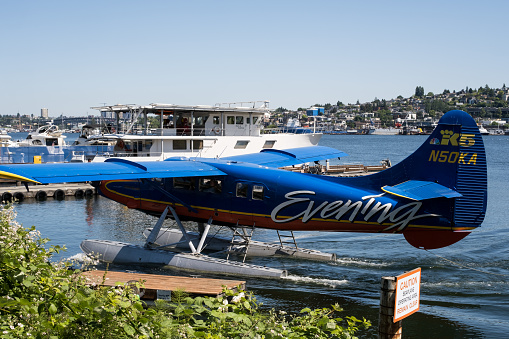 Seattle, USA - Jun 3, 2023: Late in the day a Kenmore Seaplane coming in to dock.