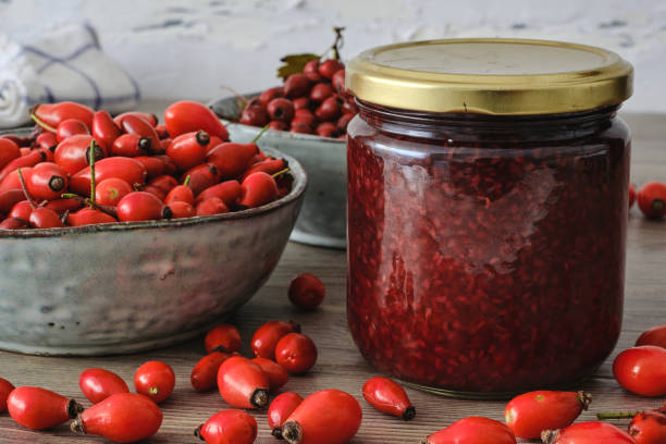 Jar of jam with red berries Homemade jelly jar with red berries rosa canina stock pictures, royalty-free photos & images