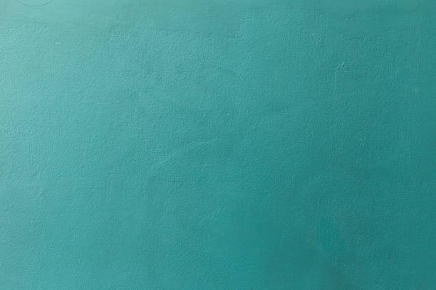 Mostly desaturated dark cyan color with an old grunge wall concrete texture as a background.