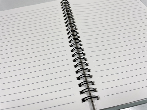 Blank white note book in recoder concept.