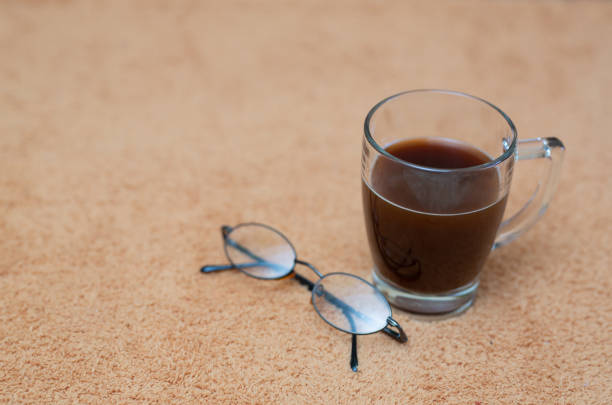 Digital tablet with a blank screen and coffee on wooden