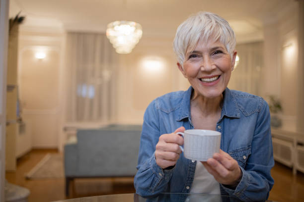 istock Woman having coffee and relaxing at home 1501023041