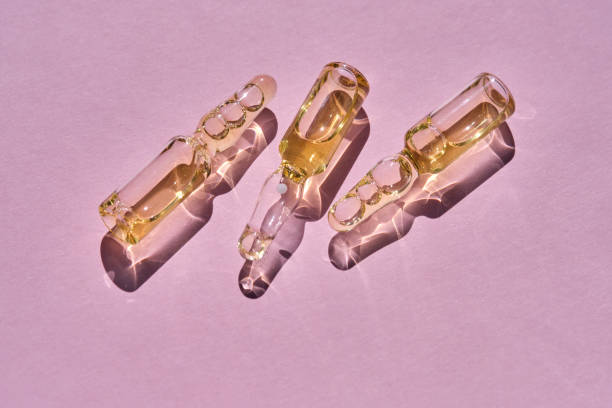 istock Ampoules on a pink background on the sun. 1501028518