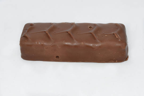 istock a chocolate bar lies on a white table 1501028691
