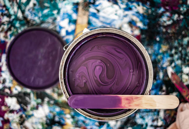 istock Paint Can Open Unmixed Close Up Purple Mixing Stick Top Paint Mess Background 1501029588