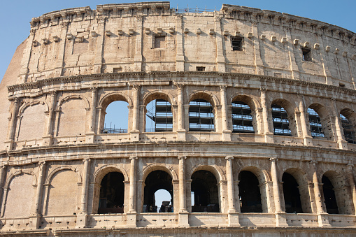 Rome, Italy 12.10.2022. Coliseum (Colosseum), Rome, Italy. Ancient Roman Coliseum is famous landmark, top tourist attraction of Rome. Scenic view of Coliseum with blue sky.