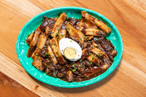 Korean foof jjajang tteokbokki with egg on a green plate