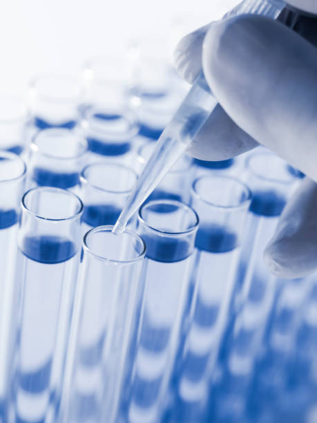 istock Droplet Falling from Pipette into Test Tube. 1501039463